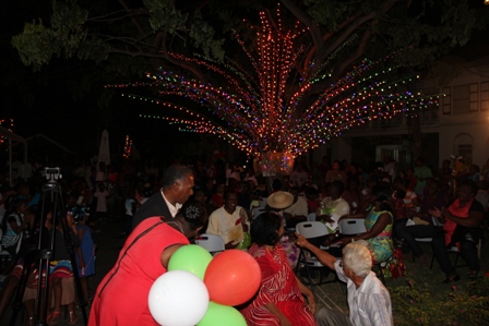 Premier of Nevis, Hon. Vance Amory, Junior Minister of Social Development, Hon. Hazel Brandy-Williams and Patron for the 2013 Christmas Tree Lighting Ceremony Ms. Rovita Butler assisted by Businessman Mr, Ken Evelyn officially turning on the switch, lighting the Memorial Square in Charlestown on December 04, 2013