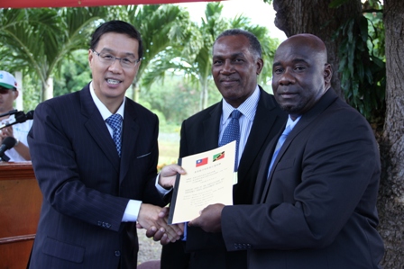 Signed documents handing the Republic of China/Taiwan’s Demonstration Farm at Cades Bay to the Nevis Island Administration by (l-r) Republic of China/Taiwan’s Resident Ambassador to the Federation His Excellency Miguel Li-Jey Tsao to Premier of Nevis Hon. Vance Amory and Minister of Agriculture on Nevis Hon. Alexis Jeffers on December 06, 2013