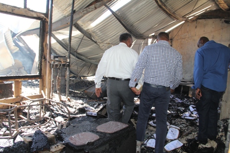 Members of Cabinet tour the gutted Treasury building which was razed by fire in the wee hours of January 17, 2014