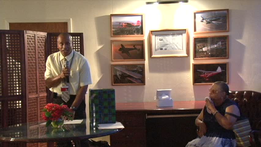 Manager of the Vance W. Amory International Airport Mr. Stephen Hanley with retiree Ms. Elvira “Fairy” Clarke who gave 22 years of dedicated service to the Airport