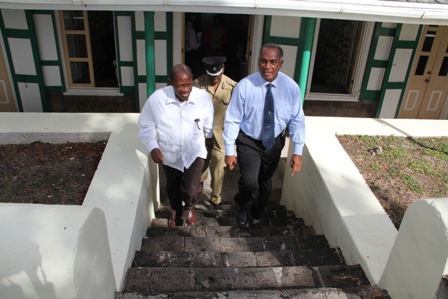 Prime Minister of St. Kitts and Nevis the Right Hon. Dr. Denzil Douglas tours the burnt Treasury Building in Charlestown with Premier of Nevis Hon. Vance Amory on January 24, 2014