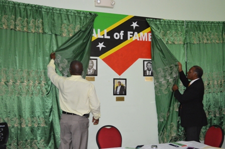 (L-R) Principal of the Charlestown Secondary School (CSS) and Sixth Form College Edson Elliott and Premier of Nevis and Minister of Education Hon. Vance Amory unveil the CSS Library & Media Centre’s Hall of Fame on February 07, 2014