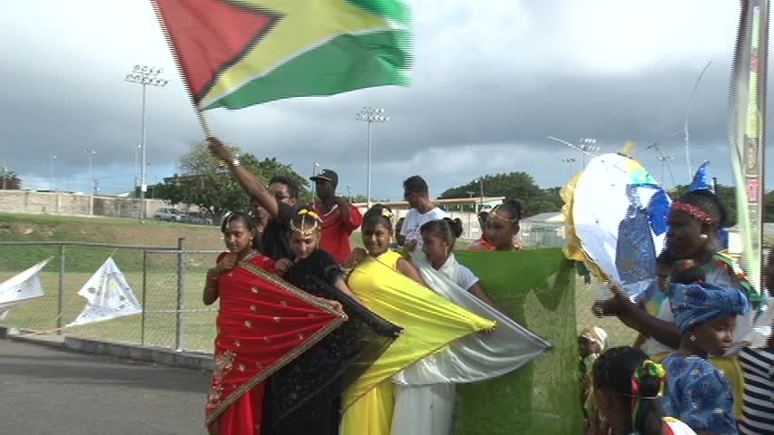 Members of the Guyanese community on Nevis show off the colours of their National flag during the 44th anniversary celebrations of Guyana Republic Day hosted by the Association at the Elquemedo T. Willett Park on February 22, 2014