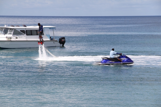 Certified staff of Islander Water Sports demonstrate Flyboarding the newest activity offered by the Nevisian-owned Company