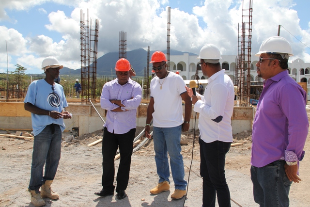Deputy Premier of Nevis and Minister of Tourism Hon. Mark Brantley (second from right) with the management team of the Residence at Tamarind Cove and Marina Project (L-R) Project Foreman Linel Amory, Project Manager Vaughn Walters and Assistant Project Manager Laughton Browne and Managing Director and local investor Greg Hardtman (extreme right)