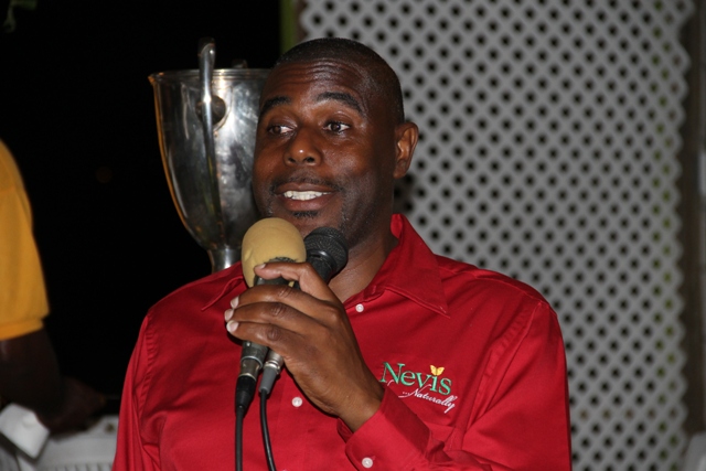 Devon Liburd Sales and Marketing Manager at the Nevis Tourism Authority delivering remarks at a cocktail reception at the Lime Beach Bar and Grill at Pinneys Beach, hosted by the Authority and the Nevis Air and Sea Ports Authority