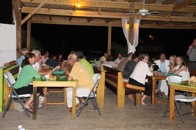 A section of persons at a cocktail reception at the Lime Beach Bar and Grill at Pinneys Beach Bar and Grill at Pinneys Beach, hosted by the Nevis Tourism Authority and the Nevis Air and Sea Ports Authority