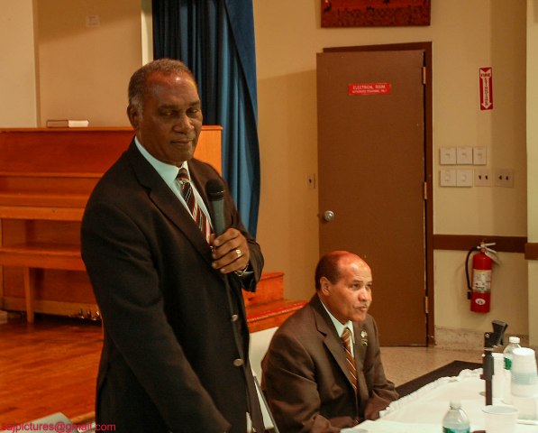 Premier of Nevis Hon. Vance Amory addressing Nevisians at the St. Luke’s Episcopal Church in the Bronx, New York on May 23, 2014 with Mr. Edmund Sadio a successful Nevisian businessman seated.