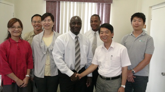 (L-R back row) Specialist Mario Cheng, Permanent Secretary in the Ministry of Agriculture on Nevis Eric Evelyn, Specialist Yu-Ming Lu. (L-R front row) Senior Entomologist and Director of the Taiwan Agricultural Research Institute Ching-Hua Kao, Hsuch-Jong Tang, Minister of Agriculture Hon. Alexis Jeffers shakes hands with team leader and Project Manager of the Vegetable Fruit and Upland Crop Quality and Safety Improvement Project in St. Kitts and Nevis Fernando Cheng-ChingYeh