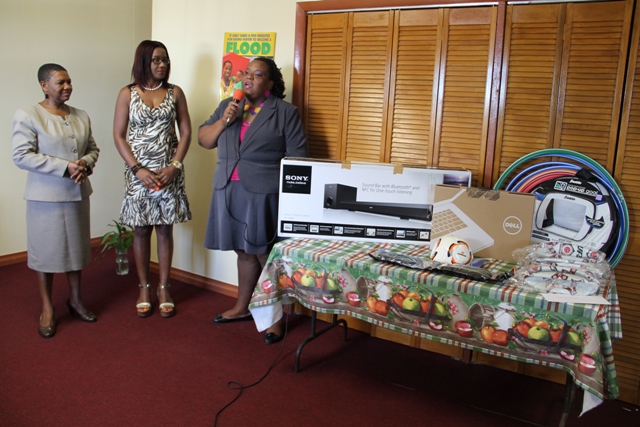 (l-r) Principal Education Officer in the Department of Education Palsy Wilkin, Vice President of the Nevis Association of South Florida Avonelle Hanley and School Library Coordinator in the Ministry of Education, Londa Browne at a handing over ceremony at the Department of Education of May 20, 2014