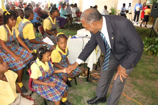 Premier of Nevis and Minister of Education greets students of the Special Education Unit at Prospect during a ceremony to rename the school in honour of its first supervisor Cecele Browne on April 29, 2014