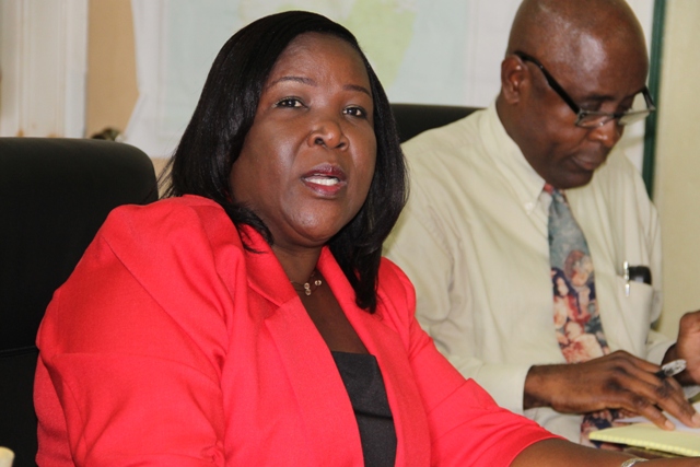 Permanent Secretary in the Ministry of Education Mrs. Lornette Queeley-Connor with Cabinet Secretary Steadmond Tross in the background