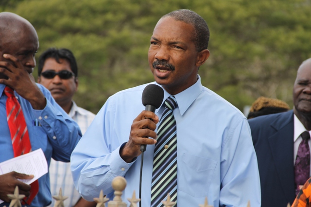 Michael Perkins who had served as Junior Minister with Mr. Guishard as Senior Minister in the Ministry of Communications and Works delivering remarks at a memorial service at Bath Cemetery on June 11, 2014, to mark the seventh anniversary of the passing of the late Malcolm Guishard who had served in the Nevis Island Administration as Deputy Premier of Nevis along with Premier Vance Amory 