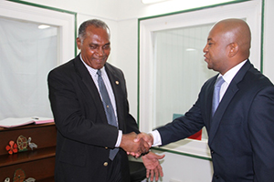 (L-R) Premier of Nevis Hon. Vance Amory welcoming new Organization of American States Representative to St. Kitts and Nevis His Excellency Terence Raymond Craig to his Bath Plain Office on August 21, 2014