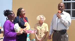  (L-R) Voices of Women (VOW) members Gweneth Browne and Nichole Lawrence with Linda Thomas who presented a gift of bedding, toys and books through VOW for the Paediatric Ward at the Alexandra Hospital and Hospital Administrator Gary Pemberton on August 07, 2014