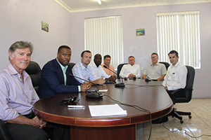 (L-R) Derya Yavalar, Hon. Mark Brantley Deputy Premier of Nevis and Minister of Health, Chris Burgess Chief Operations Officer of Omni Alpha, Engineer Marcelleus Butler, Edward Yealdhall, Recycle Manager Steve Hammond, David Johnson and Russel Marsh of Fulton Bank at the Nevis Island Administration conference room on September 24, 2014