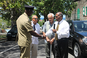 (extreme right) Premier of Nevis and Security Minister Hon. Vance Amory hands over the keys of a new Suzuki Grand Vitara to (extreme left) Assistant Commissioner of Police Robert Liburd at Bath Hotel, Bath Plain on September 18, 2014, while (middle l-r) Director of the TDC Group of Companies Michael Morton and donor and local businessman Charles Brisbane look on