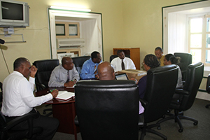 Premier of Nevis and Minister of Finance Hon. Vance Amory (extreme left) and Labour Commissioner in St. Kitts and Nevis Spencer Amory (extreme right) with other officials of the Premier’s Ministry at a meeting at Bath Plain on October 06, 2014