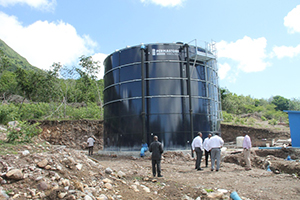 Premier of Nevis Hon. Vance Amory, Prime Minister of St. Kitts and Nevis Rt. Hon. Dr. Denzil Douglas and Junior Minister in the Ministry of Communication and Works Hon. Troy Liburd take a first-hand look at work in the Caribbean Development Bank-funded Nevis Water Supply Enhancement Project on October 08, 2014