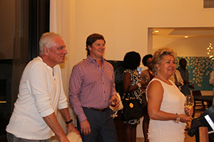 Four Seasons Resort Estates Nevis’ new Director of Sales and Marketing Eric Johnson (middle) with guests at a cocktail party on November 20, 2014 at Villa 2001, to mark the official opening of Villas on Pinney’s Beach