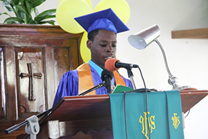 Randal Williams gives his Valedictory speech at the 41st annual Graduation Ceremony of the Gingerland Secondary School at the Gingerland Methodist Church on November 27, 2014