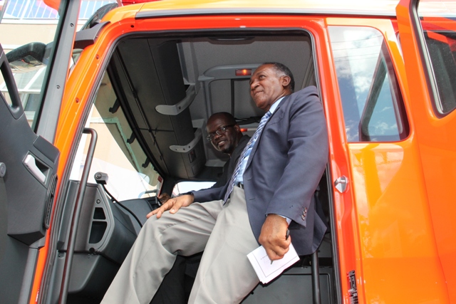 Premier of Nevis Hon. Vance Amory joins Federal Minister of Homeland Security Hon. Patrice Nisbett to inspect the new fire tender moments after it was handed over to the St. Kitts-Nevis Fire and Rescue Services Nevis Division in Charlestown on December 17, 2014