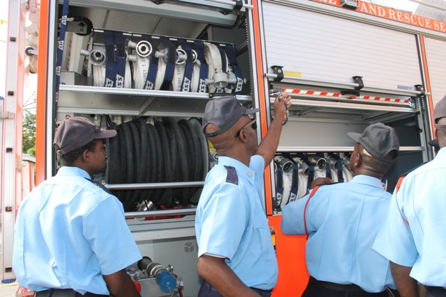Officers of the St. Kitts-Nevis Fire and Rescue Services Nevis Division inspecting the new fire tender moments after it was handed over by the Federal Government to their Division on December 17, 2014