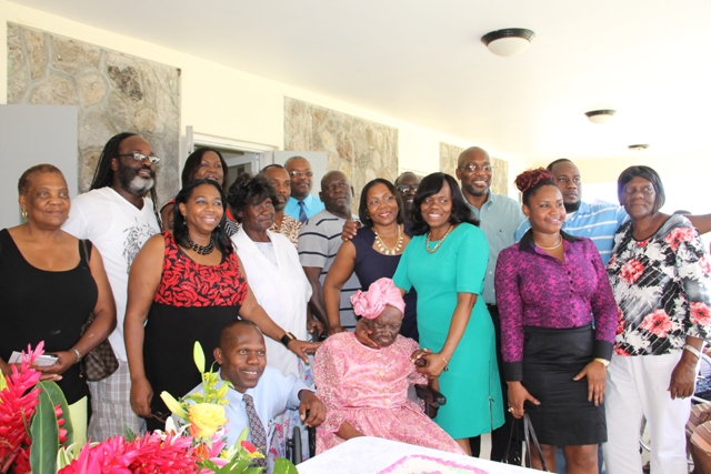 Celian “Martin” Powell surrounded by her family during her 103rd birthday on January 19, 2015, at the Flamboyant Nursing Home