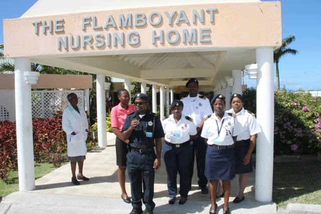  Assistant Controller of St. Kitts and Nevis Customs and Excise Department, Nevis Division Roger Fyfield speaking to the Department of Information on January 29, 2015 outside the Flamboyant Nursing Home. He is flanked by other members of the Division