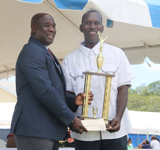 Top crop farmer in Nevis for 2014 Junior Jonas receives his Department of Agriculture award from Minister of Agriculture Hon. Alexis Jeffersat the 21st Annual open Day hosted by the Department of Agriculture