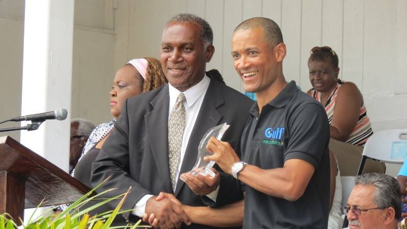 Premier of Nevis Hon Vance Amory presenting Chairman of Gulf Insurance Limited Jason Clarke with an award at the Gulf Insurance Inter-Primary Schools Championship Opening CeremonyElquemedo T. Willett Park on April 01, 2015