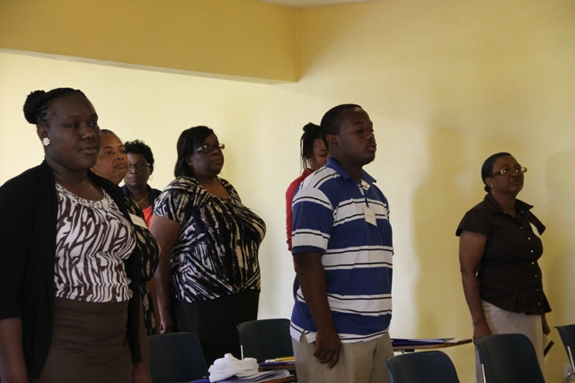 Some of the participants sing the national anthem during the opening ceremony of a Caribbean Development Bank Management sponsored Accounting Systems for MSMEs eight-day workshop on April 13, 2015 at the Ministry of Education’s Conference Room
