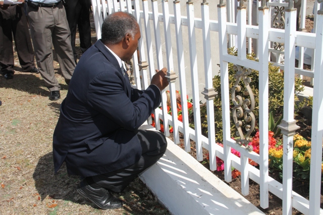 Premier of Nevis Hon. Vance Amory lays a wreath on the grave of the late Malcolm Guishard at Bath Cemetery on June 11, 2015, on the anniversary of his passing