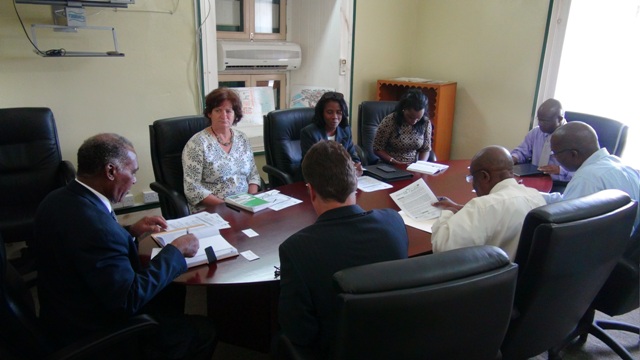 Premier of Nevis Hon. Vance Amory with a team from The Nature Conservancy (l-r top) Programme Director for the Eastern Caribbean Ruth Blyther, Country Coordinator Janice Hodge, Programme Manager for the Eastern Caribbean Dr. Shirley Constantine and (l-r bottom) Senior Director of Product Development Robert Weary with Permanent Secretaries in the Nevis Island Administration Carl Williams, Ernie Stapleton and Wakely Daniel at a meeting at the Nevis Island Administration’s Cabinet Room at Bath Hotel on June 11, 2015