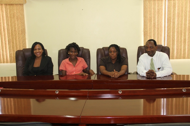 (L-R) Permanent Secretary in the Ministry of Health Nicole Slack-Liburd, 2015 Medical University of the Americas /Nevis Island Administration Health Science Scholarship awardees Clayticia Daniel and Pearl Bergan and Assistant Secretary in the Premiers Ministry Kevin Barrett at a press briefing at the Ministry of Finance conference room on July 6, 2015