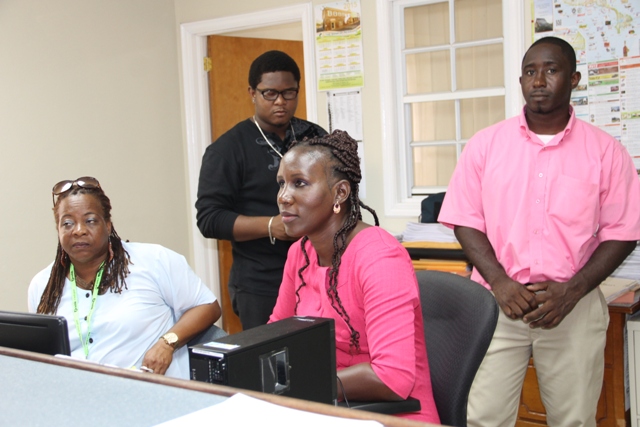 Staff at the Electoral Office on Nevis (L-R front row) Assistant Registration Officers Ernestine Rawlins and Fern Hanley-Jacobs. (L-r back row) Zavier Morrishaw from the Electoral Office in St. Kitts and Mark Mills