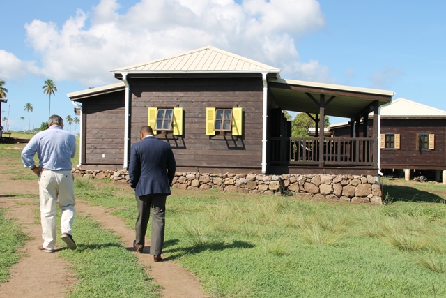 Jason Molle and Deputy Premier of Nevis and Minister of Tourism Hon. Mark Brantley walk toward one of the completed units at paradise Palms on September 23, 2015