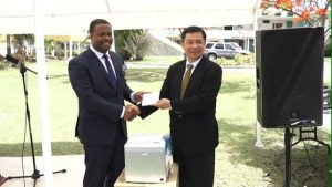 Resident Ambassador of the Republic of China (Taiwan), His Excellency Chiou Gow-Wei presents information systems to Deputy Premier and Minister of Health in the Nevis Island Administration Hon. Mark Brantley at the grounds of the Alexandra Hospital on September 18, 2015