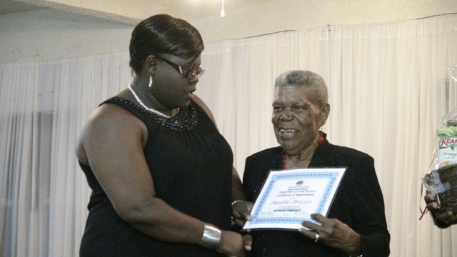 Junior Minister of Social Development Hon. Hazel Brandy-Williams presents award to Pauline Brister at the 3rd Annual Gala and Awards Ceremony hosted by the Department of Social Services’ Seniors Division at the Occasions Conference Centre on October 27, 2015
