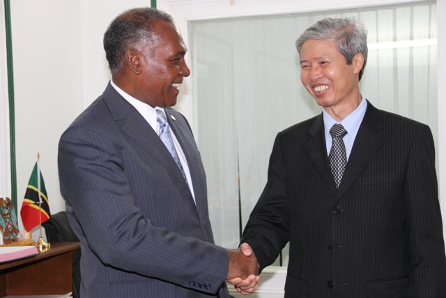 (l-R) Premier of Nevis Hon. Vance Amory welcomes the first Vietnamese Ambassador to St. Kitts and Nevis His Excellency Mr. Duong Minh during a courtesy call at Bath Hotel on November 24, 2015