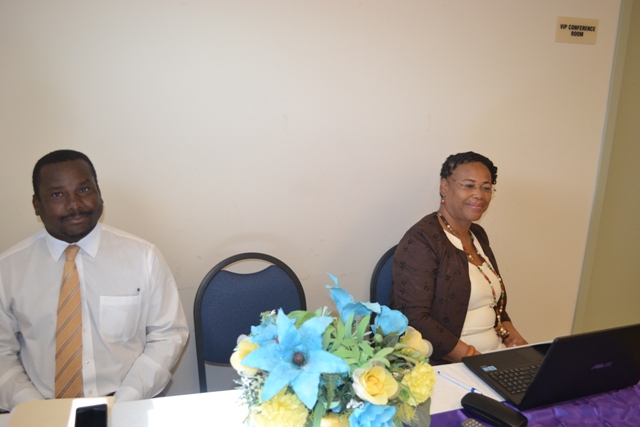 (l-r) Keith Glasgow, Permanent Secretary in the Ministry of Social Development on Nevis and Poetry Writing Workshop facilitator Cynthia Grenyion at the opening ceremony on March 22, 2016 at the Nevis Disaster Management Office Conference Room at Long Point