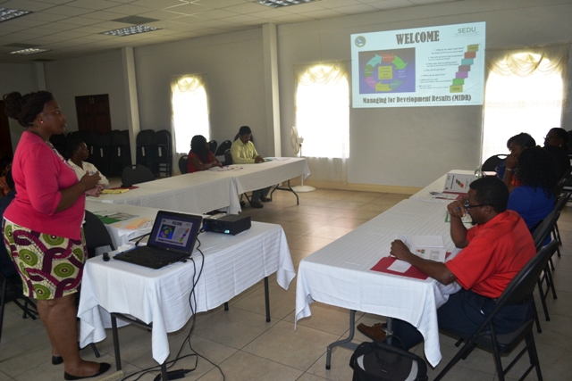 Nicole Liburd a facilitator at the Caribbean Development Bank funded Managing for Development Results workshop with participants at the St. Paul’s Anglican Church Hall on April 12, 2016