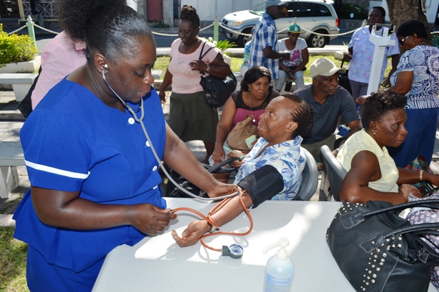 Members of the public taking advantage of the Nevis Health Promotion Unit’s free health screening activity on April 07, 2016, at the War Memorial in Charlestown in observance of World Health Day