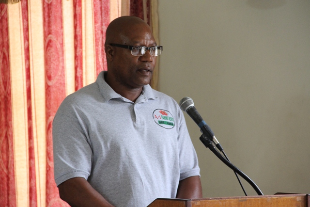 Mc Levon Tross, owner of A-1 Farms in Gingerland delivering remarks on behalf of recipients of the Department of Agriculture’s Farmers Identification Card at a ceremony to launch the new initiative at the Red Cross conference room on May 24, 2016