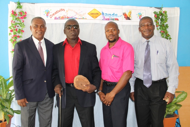 (L-R) Premier of Nevis and Minister of Education Hon. Vance Amory, former teacher at the Charlestown Secondary School Multi-Purpose Centre and patron of the Centre’s Technology and Art Exhibition Mr. Ezzard Charles, Supervisor of the Centre Mr. Grafield Virgo and Principal of the Charlestown Secondary School Edson Elliott at the exhibition at the school’s auditorium on May 26, 2016