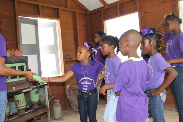 Students from the Joycelyn Liburd Primary School visiting a traditional Nevisian home at the Ministry of Tourism’s Nevisian Heritage Life at the Nevisian Heritage Village in Zion on May 05, 2016  