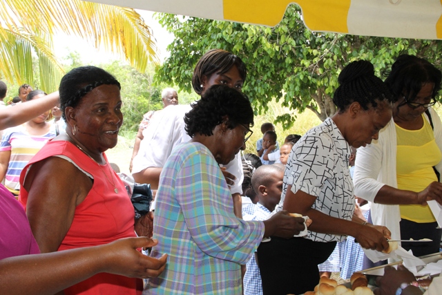 Seniors awaiting hot bread and butter at the Ministry of Tourism’s Nevisian Heritage Life at the Nevisian Heritage Village in Zion on May 05, 2016