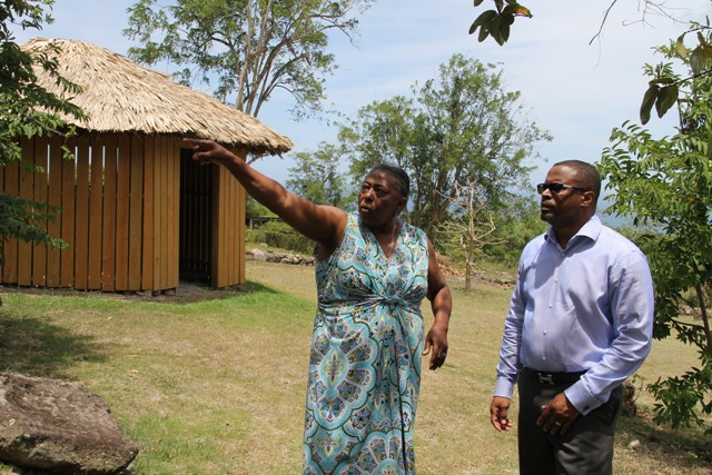 Deputy Premier of Nevis and Minister of Tourism Hon. Mark Brantley (l) and Patricia Thompson, Supervisor at the Nevisian Heritage Village at Fothergills during a tour on June 28, 2016