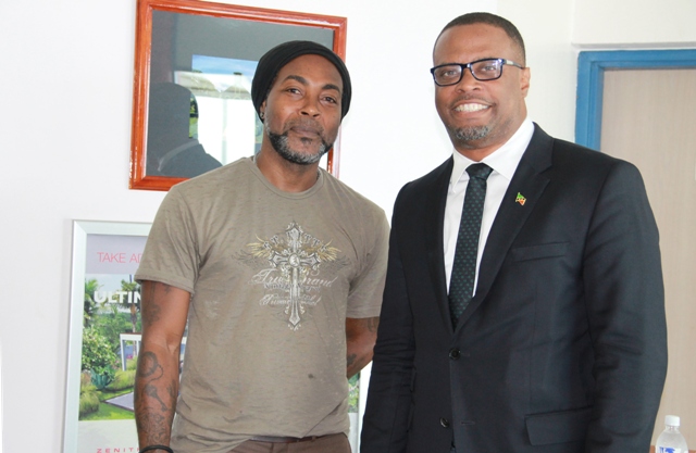 (L-r) Sylvester Meade, the Ministry of Tourism’s 2016 Photographer of the Year with Tourism Minister Hon. Mark Brantley at the Vance W. Amory International Airport on May 31, 2016, to launch an exhibition showcasing Meade’s photography