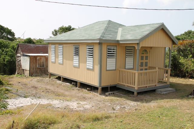 The new home handed over to Marjorie Walters of Brick Kiln Village by the Ministry of Social Development through its Community Housing Programme. It is constructed in front of her old residence